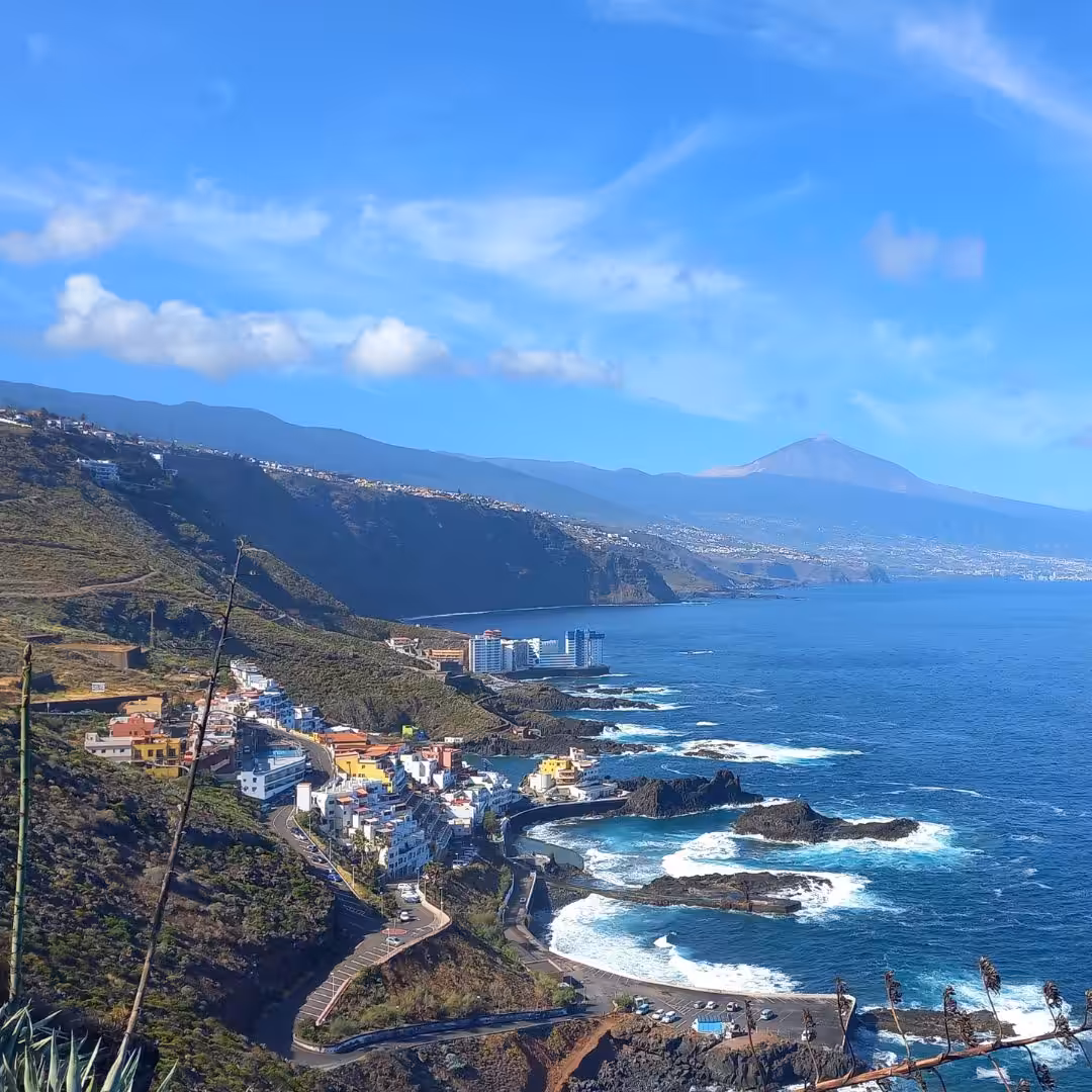 Rolling mountains with coastal views, sea and waves