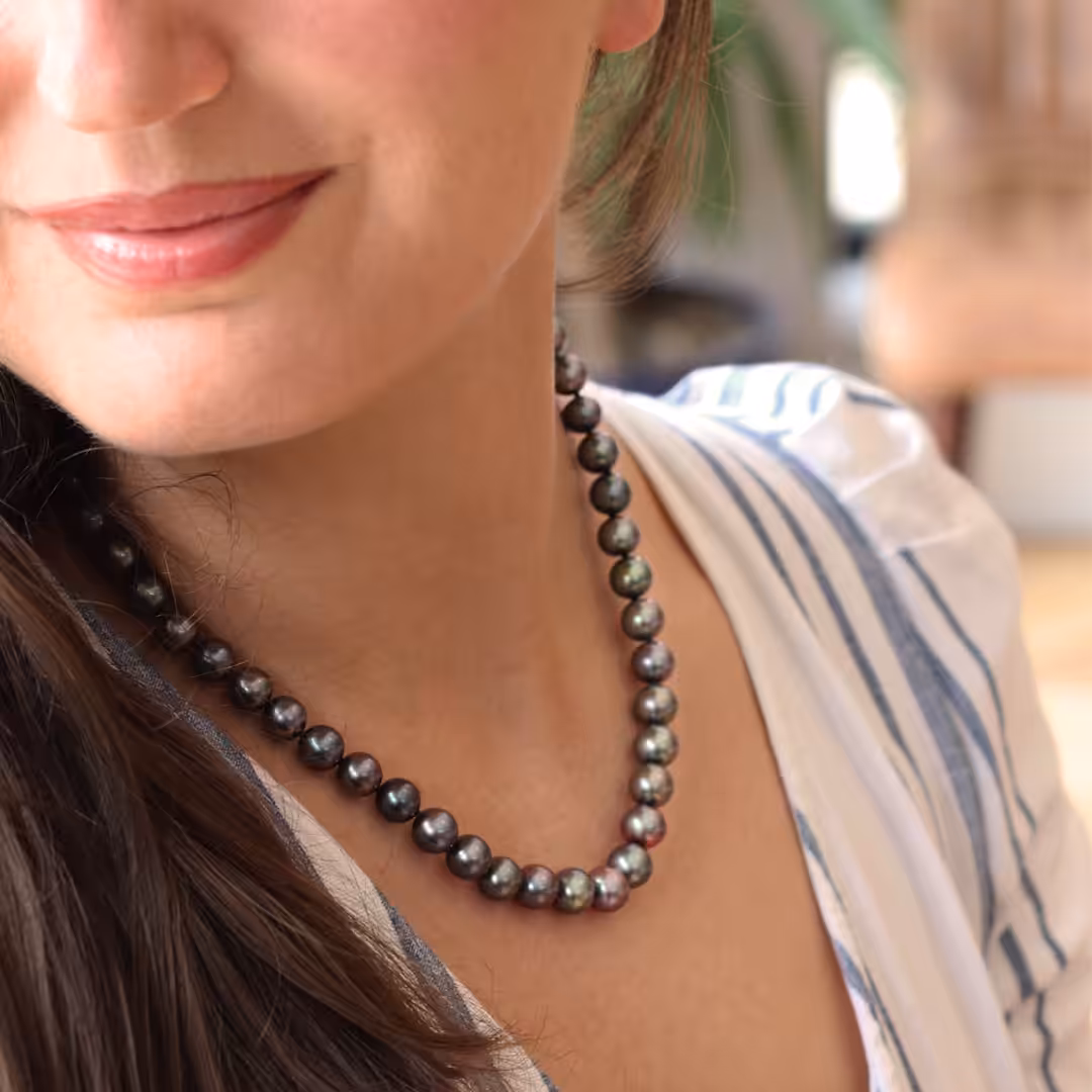 Model wearing peacock freshwater string necklace